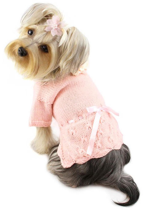 Klippo - Adorable pink hand-knitted sweater with adjustable ribbon intertwined around the waist.  Accented with a crocheted flower at the neckline.  A small D-Ring near the neckline for a "Klippo" charm or ID tag.