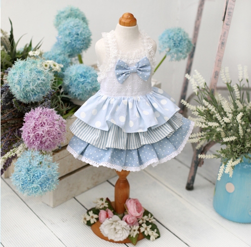 Juny Bell - Bianca - This dress is simply beautiful.  Embroidered eyelet bodice is accented with bow, and has elastic lace shoulder straps.  Various sky colored fabrics create the 3-tiered ruffle skirt.